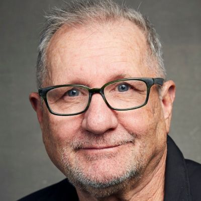 Catherine Rusoff  husband, Ed O'Neill posing for a photo shoot.